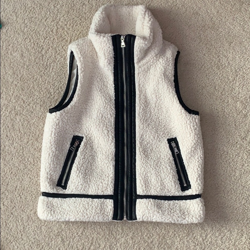 Cream winter vest with black trim